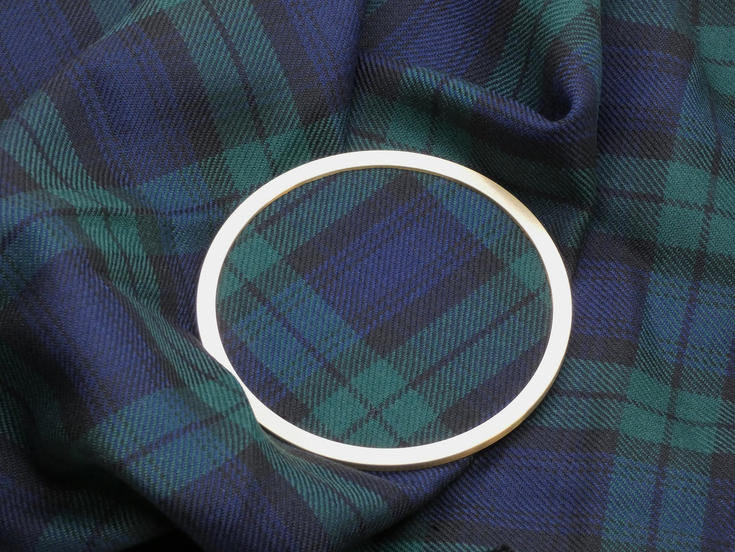 Black Watch Tartan Brass Coaster on Tartan Wool Fabric