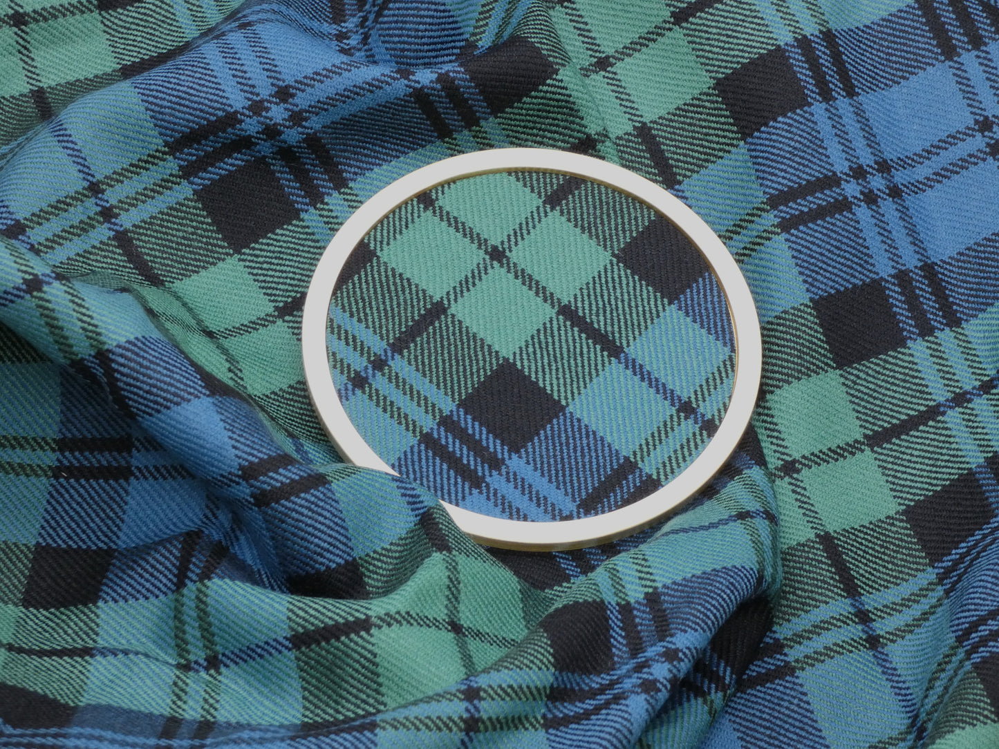 Campbell Ancient Tartan Brass Coaster on wool tartan Fabric