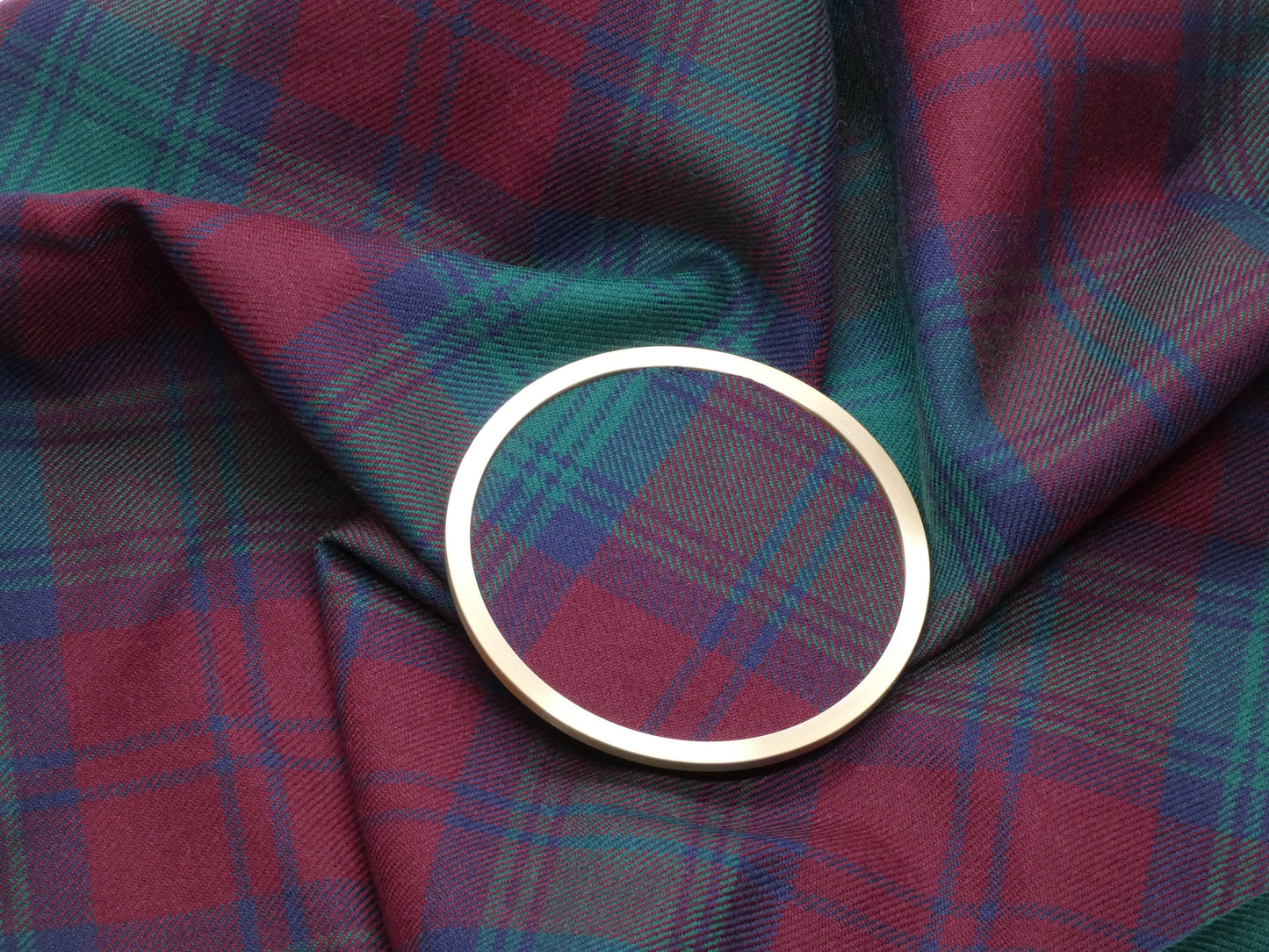 Lindsay Modern Tartan Brass Coaster on Tartan Wool Fabric