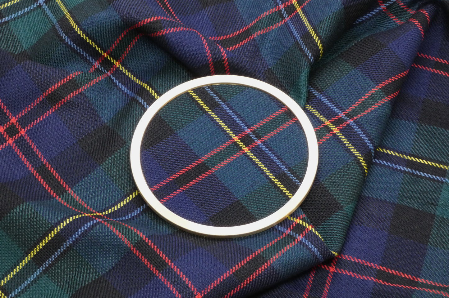 Malcolm Tartan Brass Coaster on Tartan Wool Fabric