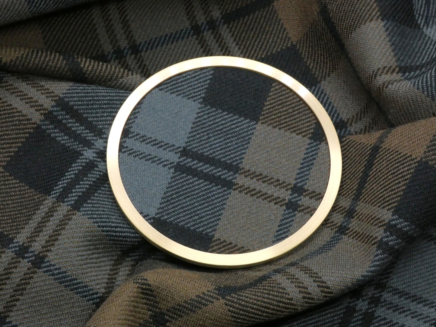 Weathered Black Watch Tartan Brass Coaster on Fabric